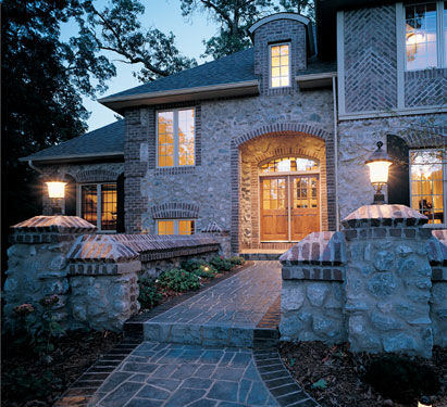 Grand European house plan with striking stone walkway entrance