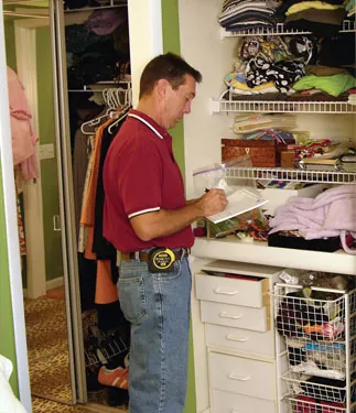 appraiser looking at home appraiser looking at home