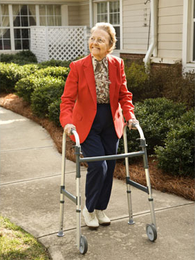 elderly woman using walker elderly woman using walker